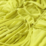 CARMEN | VESTIDO LARGO PLISADO AMARILLO CON CUELLO HALTER